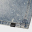 Lé Geit Studio light blue denim shorts featuring white paint splatter details and embedded rhinestones.